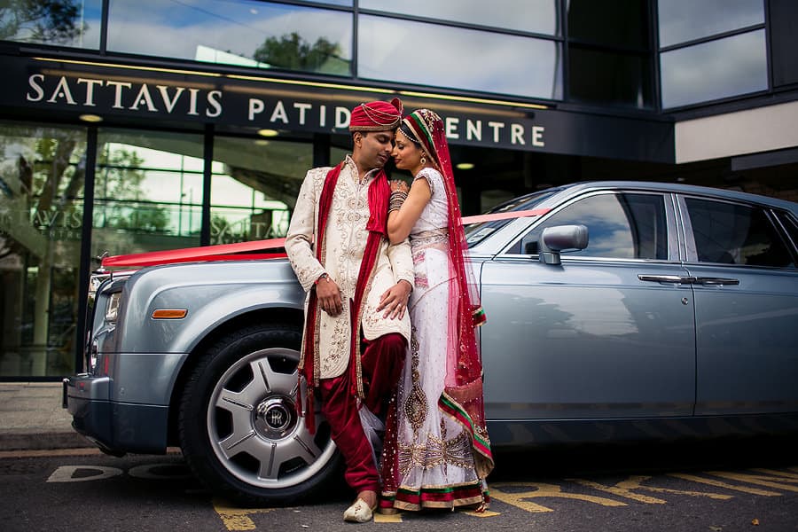 sattavis patidar centre, exterior, asian wedding photographer, bride and groom posing